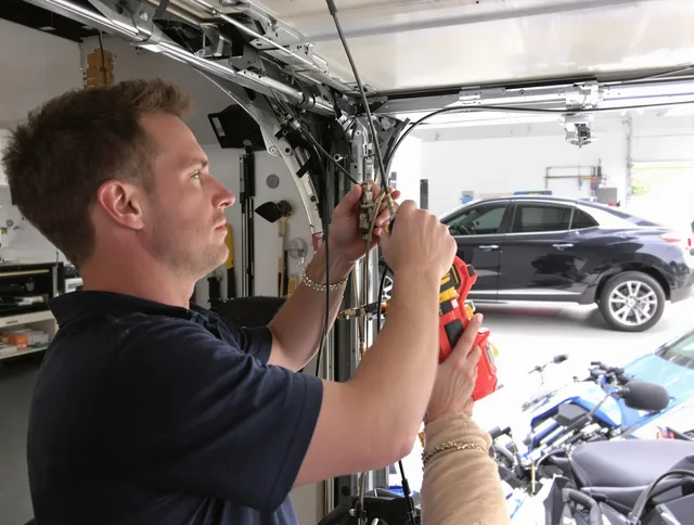 Bradenton Garage Door Repair safety certified technician performing cable replacement in Bradenton