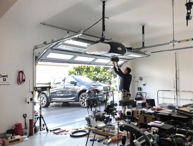 Bradenton Garage Door Repair specialist installing smart garage door opener system in Bradenton home